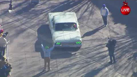 The Grinch shows off his style in a mint green lowrider at the Durham Holiday Parade