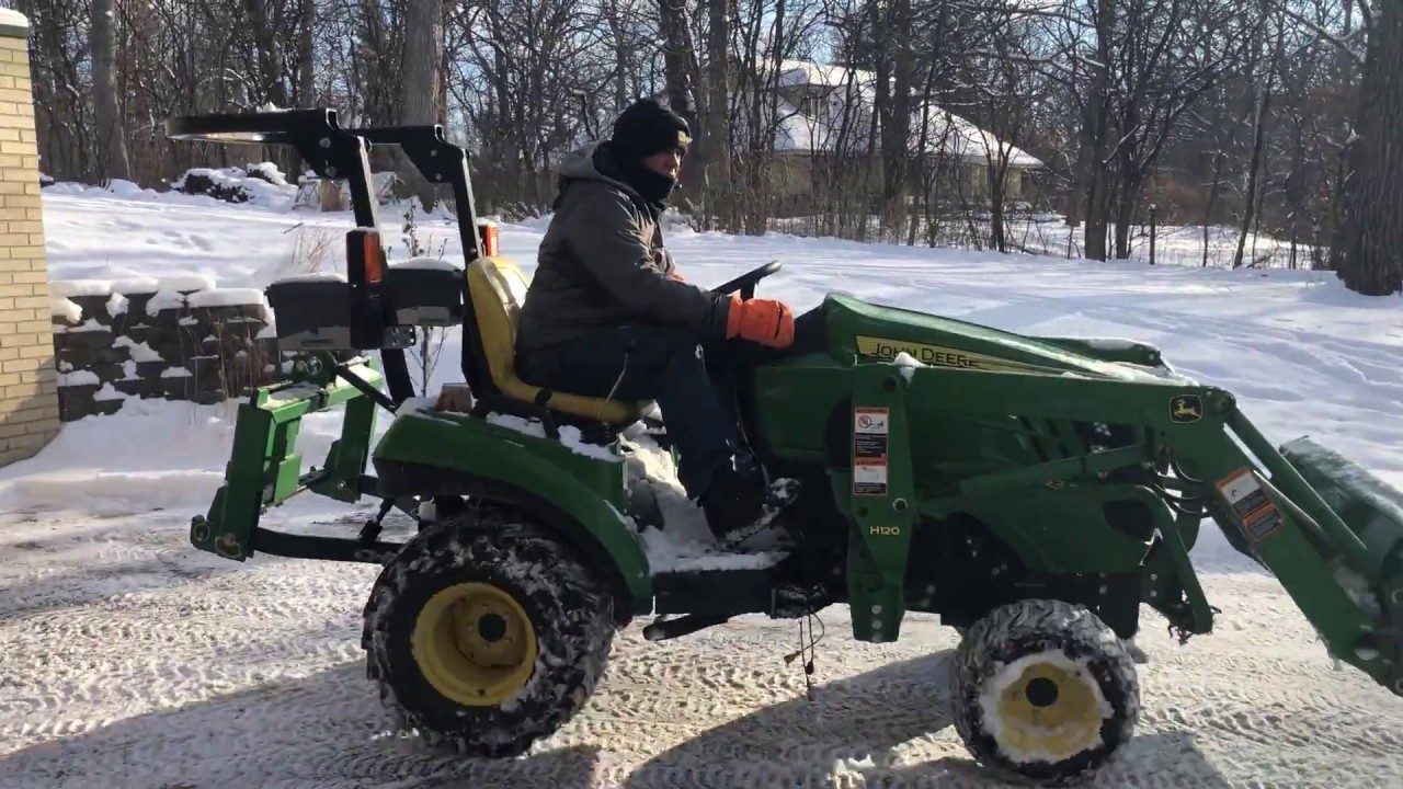 Plowing your driveway with a 1023e/1025 John Deere. See Description!!!!!!! tipsbmx