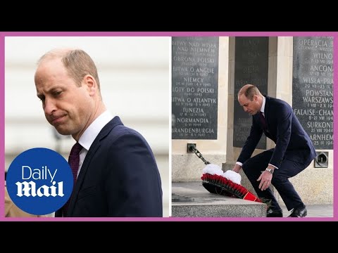 Sombre Prince William lays wreath during his visit to Poland