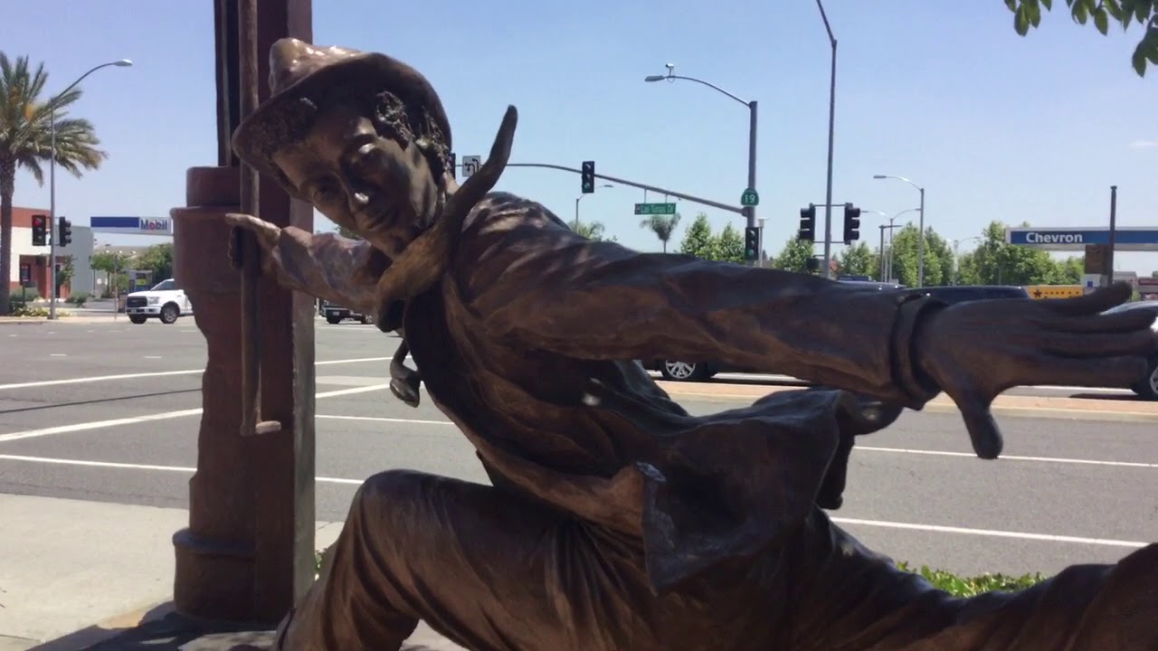 Temple City California businessman sculpture Jump on. YouTube