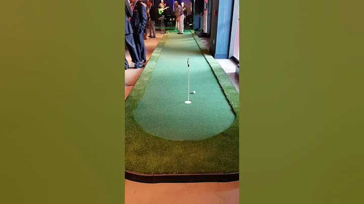 Mark Swingler on portable putting green 40X6