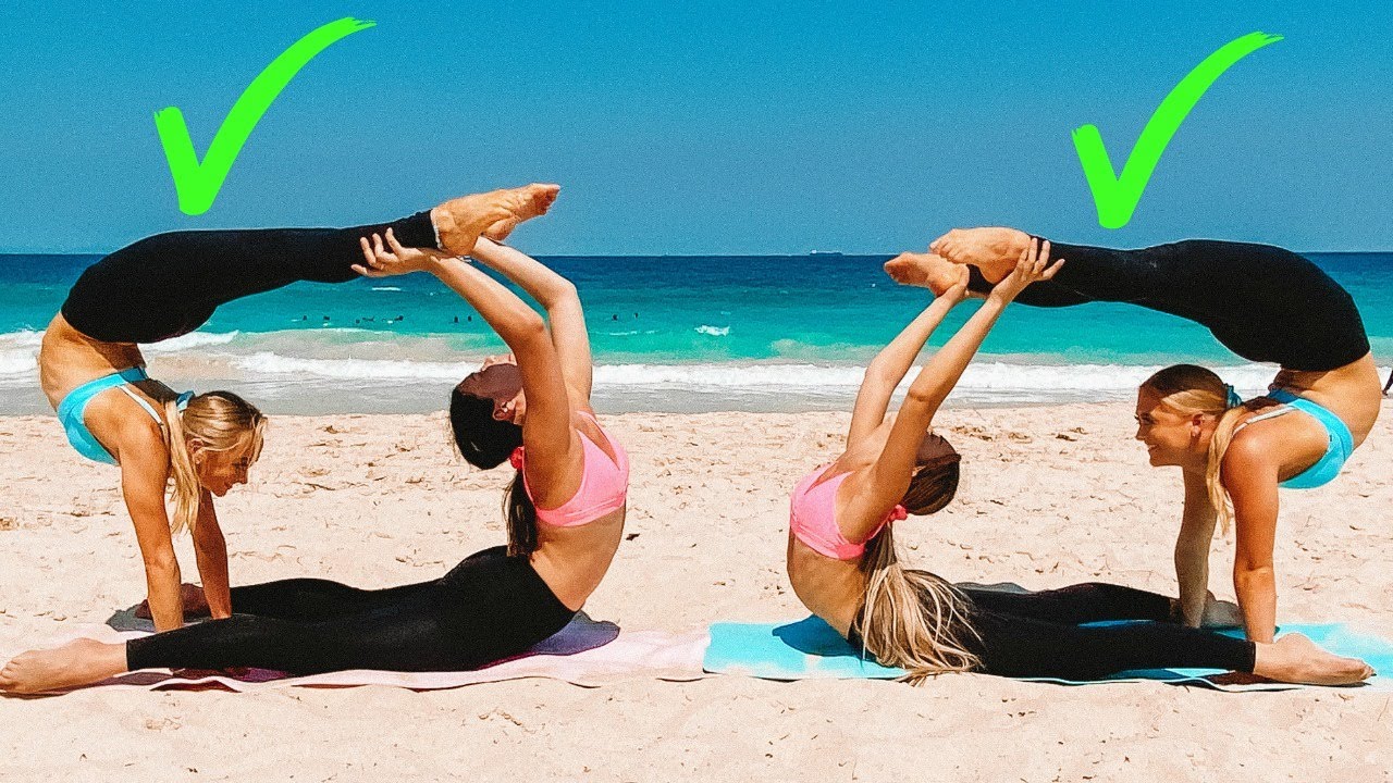 Two sports girls practice yoga Stock Photo - Alamy