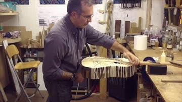 Pablo Requena fitting the bindings on a classical guitar