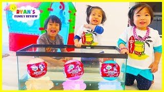 ryan emma and kate opens surprise toys in the fish tank and learn colors