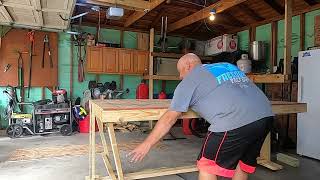 Work bench that folds and will roll away.