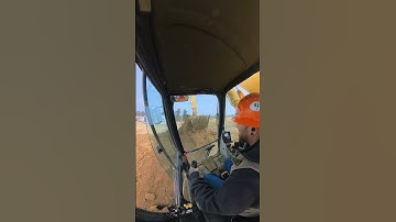 Climbing a pile with a kobelco 235