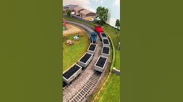 Model Trains Pushing Wagons