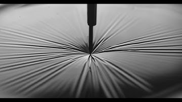 Penetration of a floating elastic sheet on water