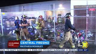 Fire crews put out fire behind Disabled American Veterans Charities thrift store in Central Fresno