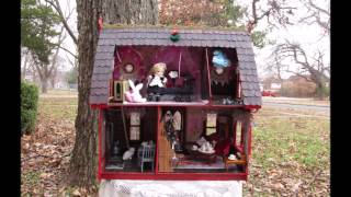 Dollhouse with doll, furniture and accessories.