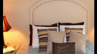 DIY Upholstered Headboard with Nail Trim Things I used: 1.5 inch Foam 1/4 inch plywood Box of nail trim Rubber mallet Fabric of choice Cotton batting Jigsaw Sand paper wall