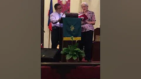 Barbara Paulson and Pastor Nelson singing "He Touc...