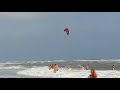 A kitesurfingist rescues a man who was carried away to sea during a storm .