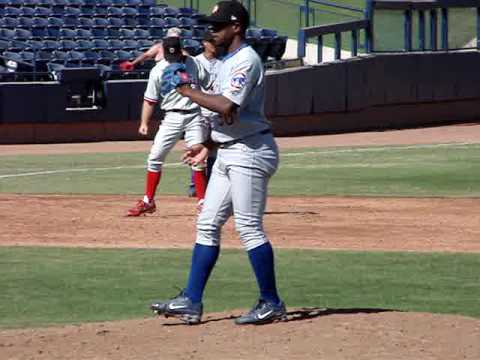 Esmailin Caridad throws warm up tosses during a 2008 Arizona Fall League meeting between the Mesa Solar Sox and the Peoria Javelinas. Caridad was signed by the Chicago Cubs in 2007 by scout Jose Serra. He made his professional debut in 2007 with the Hiroshima Carp of the Japan Central League.