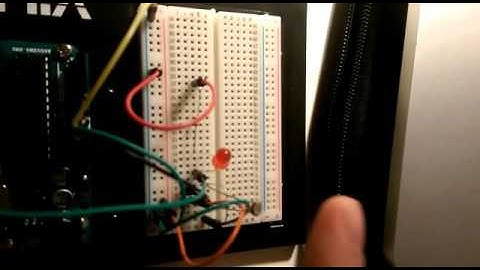 Build a circuit that lights an LED when it is sufficiently dark in a room.