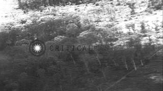 US F8E Crusader launches rockets and strafes the target area during an air strike...HD Stock Footage