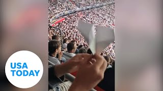 Soccer fan scores a goal from the stands with a paper airplane | USA TODAY screenshot 3