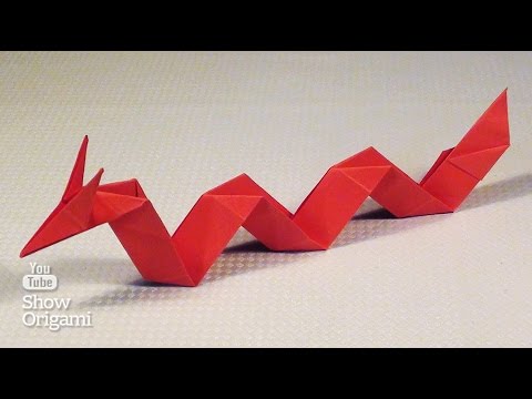 Simple Asian dragon made of paper with your hands.