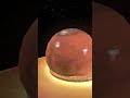 Forging Mars: Crushing the Red Planet into a Cosmic Coin