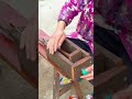 the process of flattening plastic bottles using a small wooden board #construction #popular #shorts