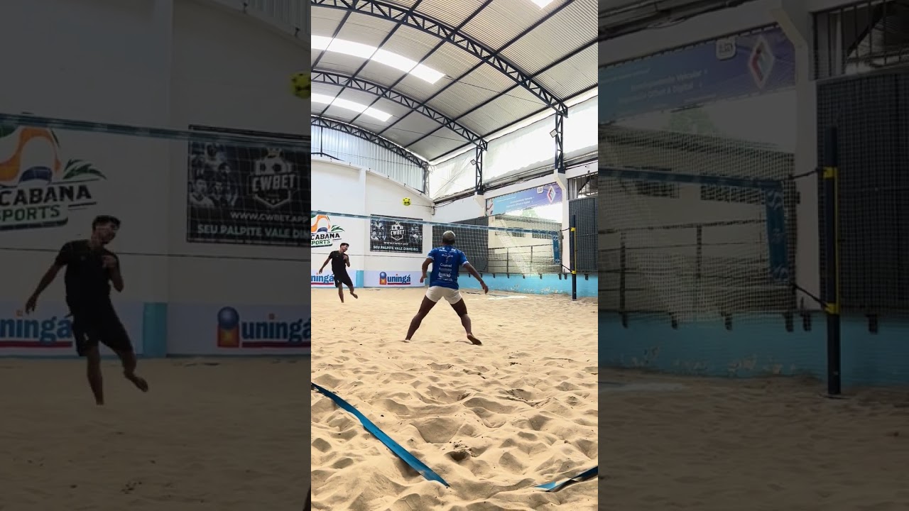 Intense Footvolley Match on Indoor Sand Court