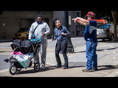 Armed NC demonstrators eat at a Subway, man with pipe wrench approaches family