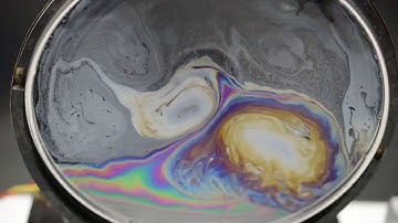 Vortex dipoles in a vibrating soap film