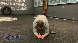 Advanced Core: Front Plank with Plate Drag
