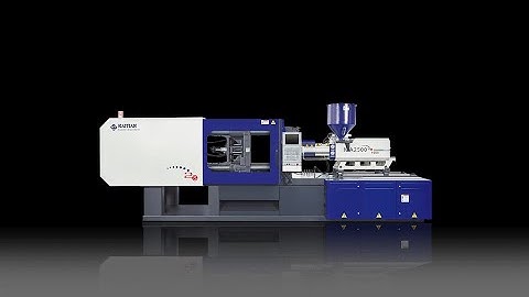 Haitian plastic injection molding machine making auto parts with robot arm