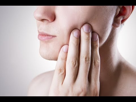 Wideo: Ziarniniak Zęba - Przyczyny, Objawy, Leczenie