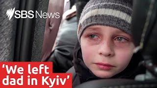 Ukrainian boy describes fleeing his home as his father stays behind | SBS News