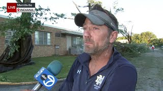 Employee of Ind. HS fights back tears after surveying storm damage