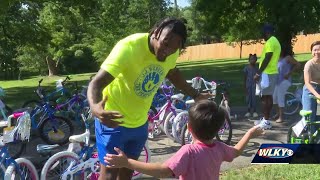 UK's J.J. Weaver hosts bike day for youth in Louisville