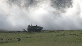 A Romanian Platoon defends a village from opposition forces simulated by US and Macedonian soldiers, on Hohenfels training area, Germany, as they take part of exercise Saber Junction 2015, April 16, 2