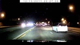 Night time driving footage using DealExtreme/SainSpeed car DVR dash camera.