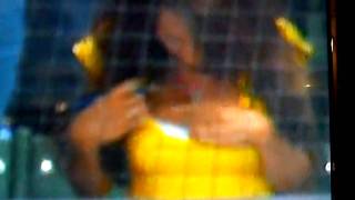 The Woman in the yellow shirt behind home plate at the Brewer game