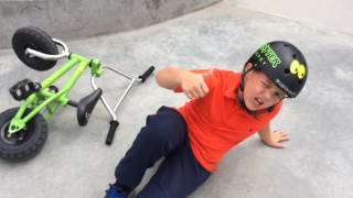 8 Year's old twin brothers on mini BMX bike in skate park