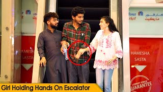 Girl Holding Stranger's Hands On Escalator @CrazyPrankTV