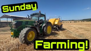 John Deere Bales Big Hesstons with the New Holland Baler!