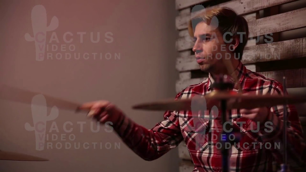 Expressive drummer playing drums with drum stick