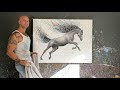 Ashvin harrison painting a horse with coconut charcoal dust and paints