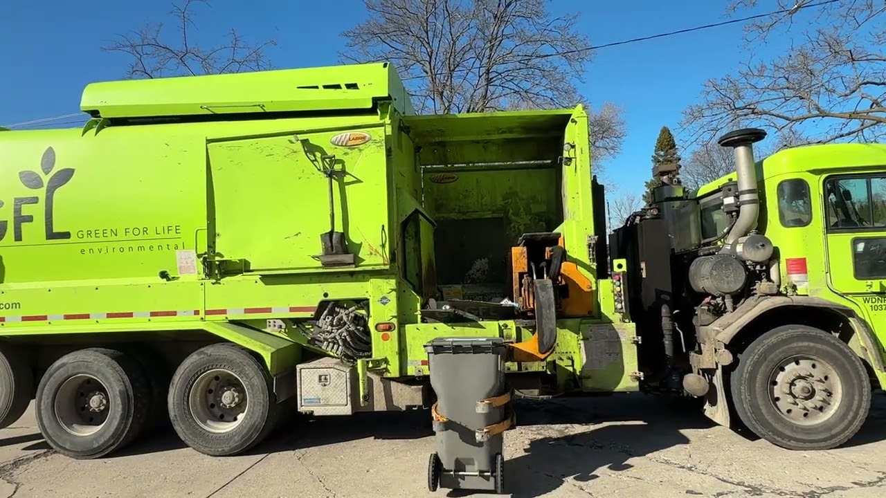 GFL Environmental’s CNG Peterbuilt 520 Labrie Expert picking up recycling part 1.