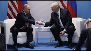 Trump and Putin meet and shake hands