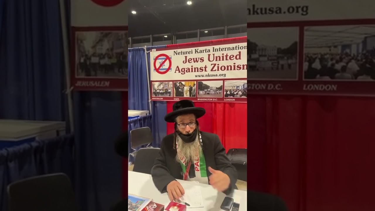 Rabbi at his booth at a Muslim convention