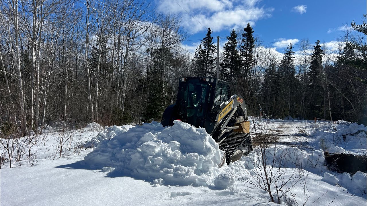 PUTTING THE NEW HOLLAND C345 TO WORK CLEARING SNOW! 