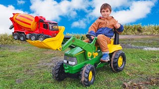 JOHN DEERE Tractor Pulls Cement Mixer Out of Mud