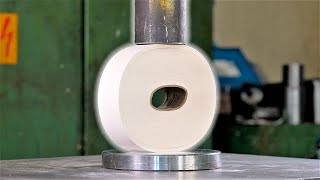 Crushing giant paper roll with hydraulic press