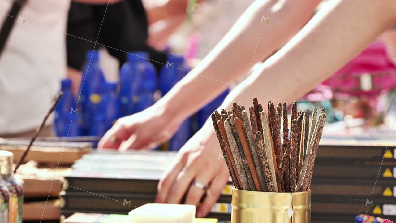 Incense sticks standing in a golden container in India
