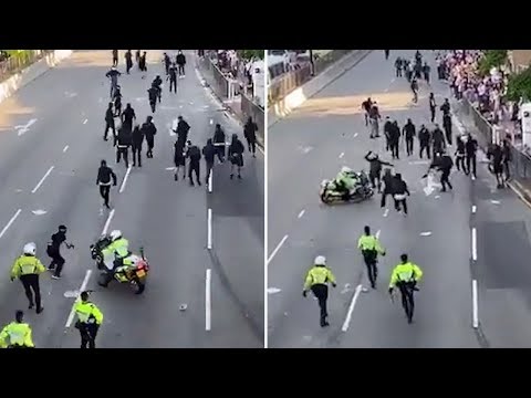 hong-kong-police-officer-drives-motorcycle-into-protesters