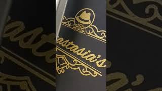 Screen printing ultra gold shimmer ink on black shirts for the good folks at Anastasia&#39;s.